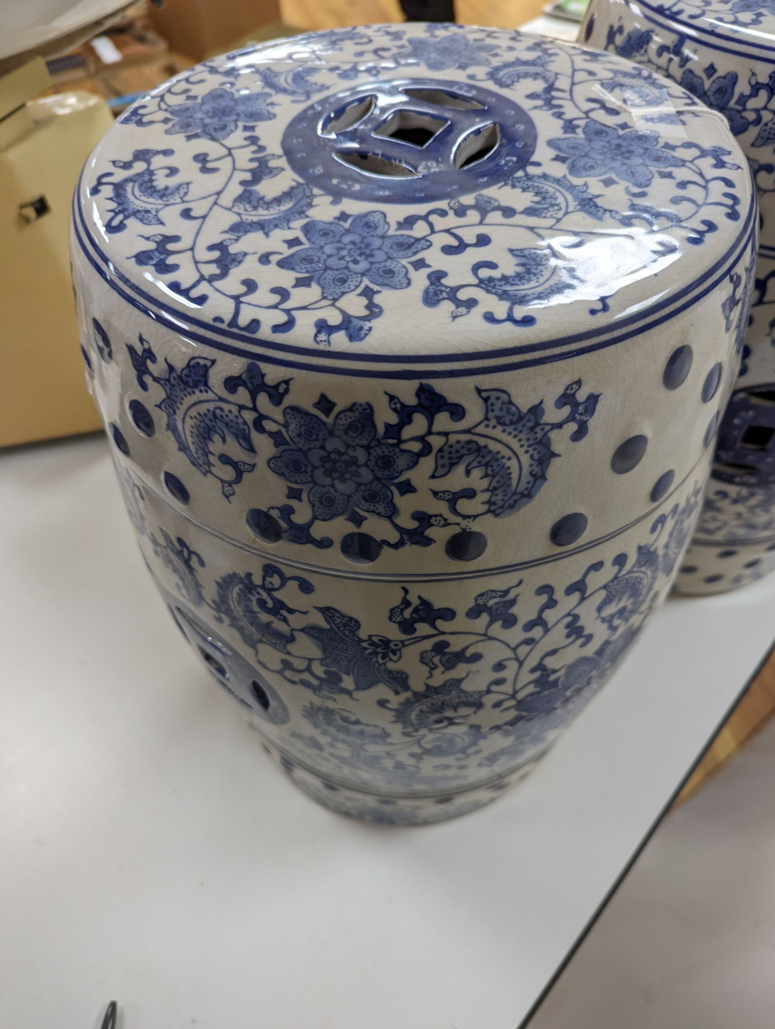A pair of Chinese blue and white garden seats, 44 cms high.